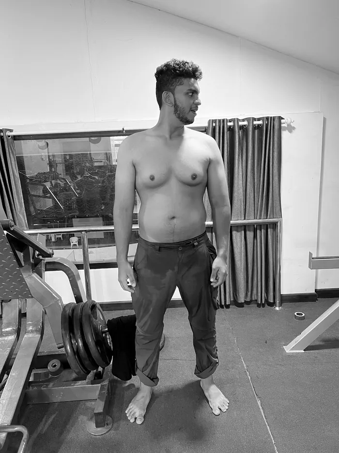 Client four before the program — soft midsection, side profile